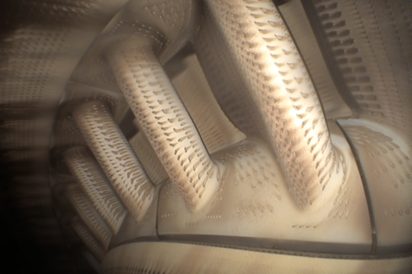 abstract view of textured cylindrical structures showcasing intricate design patterns and highlighting engineering innovation in modern technology