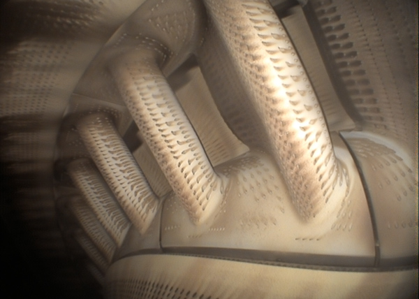 close up of a turbine engine component showcasing intricate patterns and textures related to aerodynamics and efficiency in a three dimensional configuration
